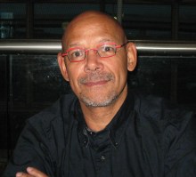 photo of charles wearing red glasses and black shirt